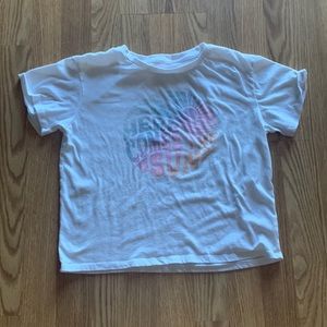 a white here comes the sun shirt